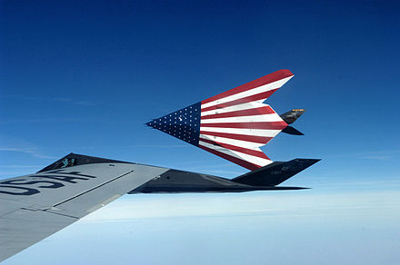 A pair of specially painted F-117 Nighthawks sporting a United States flag theme on their bellies fly off from their last refueling by the Ohio Air National Guard's 121st Air Refueling Wing