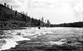 Boat navigating the Whitehorse Rapids on the Yukon River, Yukon Territory, between 1893 and 1903 (AL+CA 1245).jpg