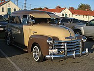 Chevrolet 3100 panel van with after-market wheels and tires