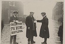 Two men collecting for the victims of The Great Timber Yard Fire in Hartlepool, 1922. Set up by the mayor of Hartlepool the day after the blaze, the fund soon gained popular support from places all over the region, such as Durham and Newcastle, as well as from further afield. Collecting for Victims (5758082135).jpg