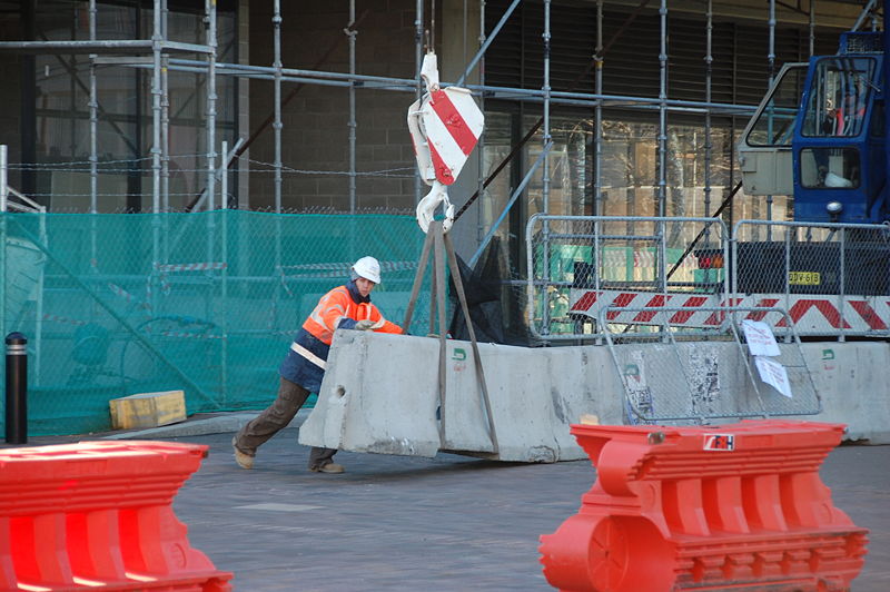 File:Construction Worker moving concrete barrier DSC 0474.jpg