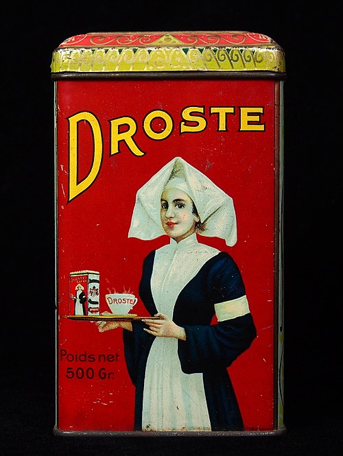 A visual form of recursion known as the Droste effect. The woman in this image holds an object that contains a smaller image of her holding an identic