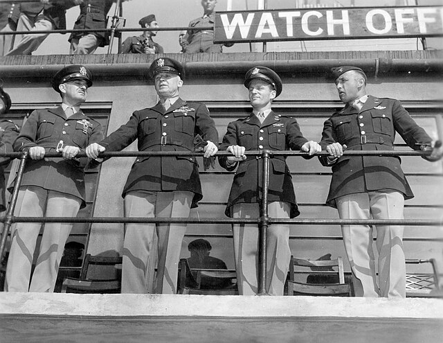 Senior USAAF personnel including Colonel Stone and General Hap Arnold on the control tower at Duxford, 1943