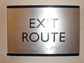 Exit route sign with braille
