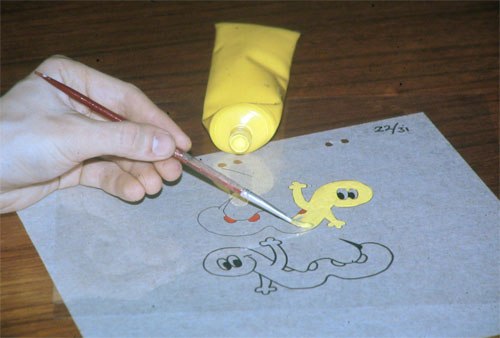 Painting with acrylic paint on the reverse side of an already inked animation cel, here placed over the original drawing