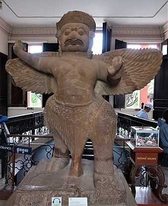Garuda (Khmer: គ្រុឌ, Krŭd) in Koh Ker style. Made of sandstone, this statue is from the first half of tenth century, (Angkor period). On display at the National Museum of Cambodia.