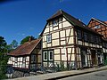 Residential and commercial building with outbuildings