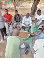 Group unshelling groundnut in Northern Ghana 01