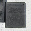 Plaque dedicated on November 24, 1940, on the front of museum.
