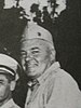 Picture of a man in his mid-50s wearing United States Marine Corps summer service uniform.