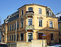 Tenement house with fencing, in a corner and open development