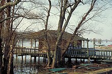 A marina house on the lake built on stilts. HouseOnHorseshoeLakeAR.jpg