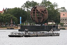 The Earth Globe is moved into position as a fireworks barge is prepared for the show. IllumiNations barge and Earth Globe.jpg