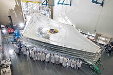 Test unit of the sunshield stacked and expanded at the Northrop Grumman facility in California, 2014 James Webb telescope sunshield.jpg