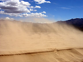 Sand blowing off a crest in the Kelso Dunes of the Mojave Desert