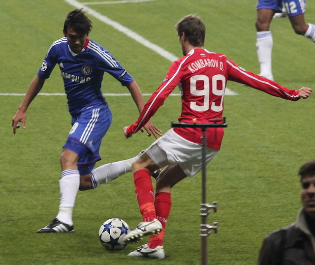 Ferreira challenging Dmitriy Kombarov of Spartak Moscow in the 2010–11 Champions League