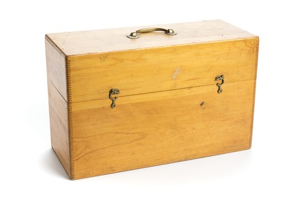 A wooden box with a hinged lid
