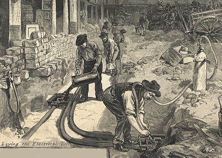 Workmen burying Edison DC power lines under the streets in New York City in 1882. This costly practice played to Edison's favor in public perceptions after several deaths were caused by overhead high voltage AC lines.[9]