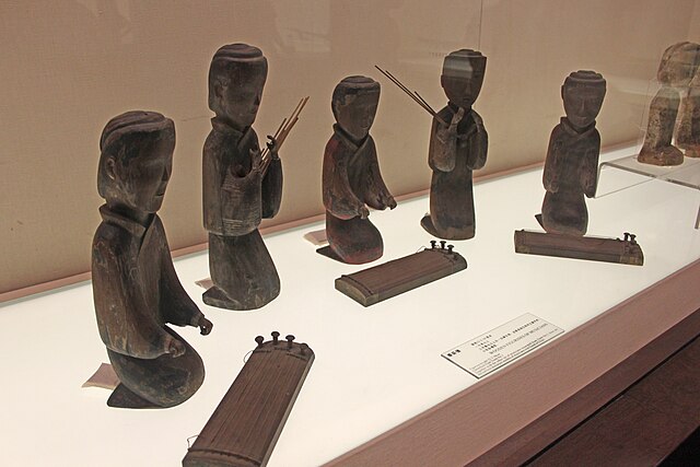 Ensemble of musicians, some playing the Guzheng and others play the Sheng, 2nd century BCE, Mawangdui tomb.