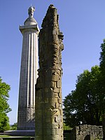 The Montfaucon column seen next to part of the nearby abbey ruins.