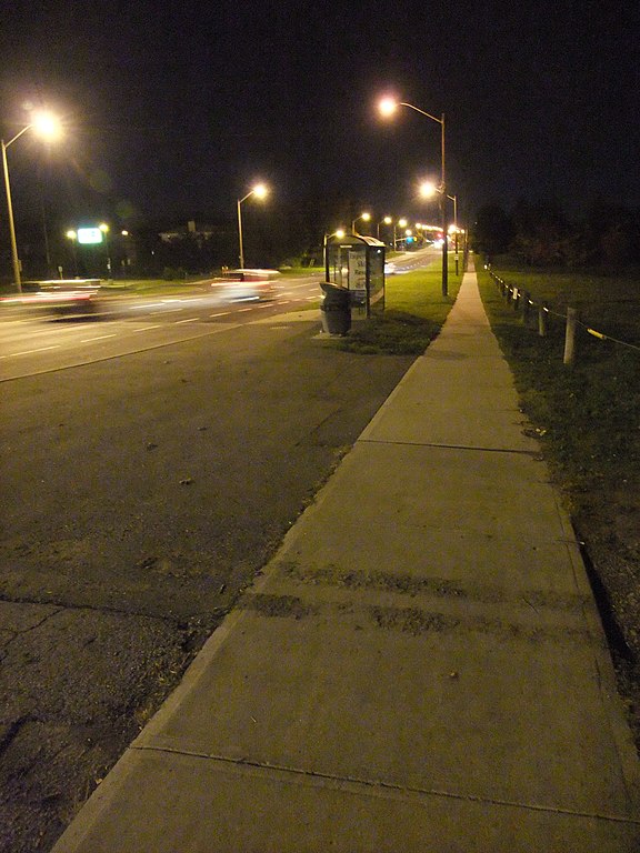 city sidewalk at night