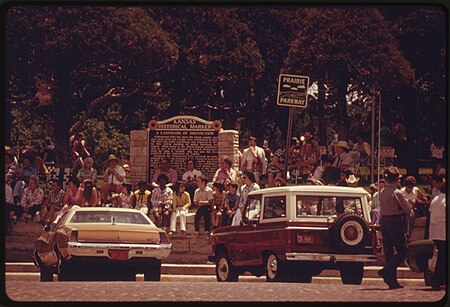 PEOPLE CONGREGATE IN THE TOWN SQUARE IN COTTONWOOD FALLS KANSAS, NEAR EMPORIA, WAITING FOR THE PARADE TO PASS. IT IS... - NARA - 557057.jpg