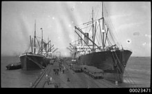Persic (left) and Ceramic (right) loading at Sydney in the 1920s PERSIC on left and CERAMIC on right, both of the White Star Line. (3307507923).jpg