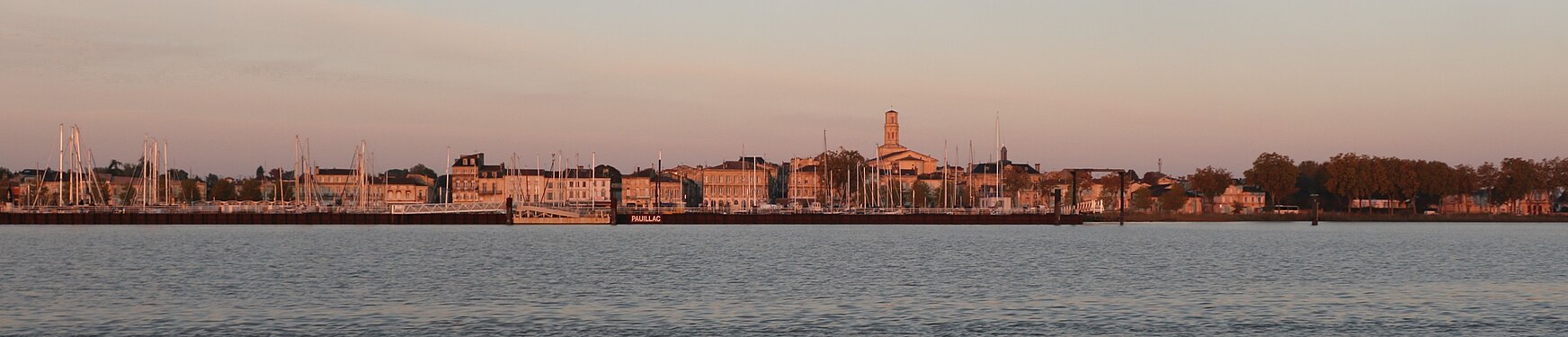 Early morning view of town quay and harbor on the Gironde estuary, Pauillac, France