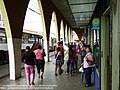 People at Ciudad Quesada, Costa Rica municipal market bus stop.jpg