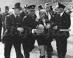 Rudolf kreitlein escorted by police.jpg