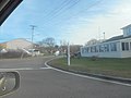 The first southbound reassurance sign for CR 77 is south of the intersection. Montauk's street name signs are still sticks in the ground with the street names painted on them