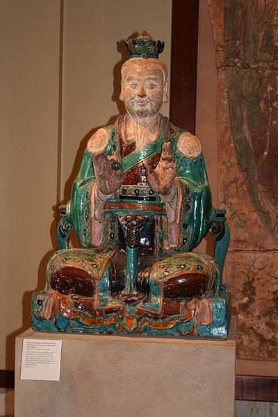 Chinese glazed stoneware statue of a Daoist deity, from the Ming Dynasty, 16th century.
