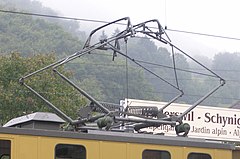 The diamond-shaped, electric-rod pantograph of the Swiss cogwheel locomotive of the Schynige Platte railway in Schynige Platte, built in 1911 Schynige Platte diamond pantograph.jpg