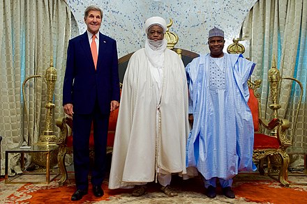 U.S. Secretary of State John Kerry poses for a photo with Sultan Muhammadu Sa'ad Abubakar, and Governor of Sokoto Aminu Waziri Tambuwai at the Sultan's Palace in Sokoto, Nigeria, on August 23, 2016, before the Secretary held meetings with religious leaders and delivered a speech about countering violent extremism. Secretary Meets With Religious Leaders in Sokoto, Nigeria (29176258455).jpg