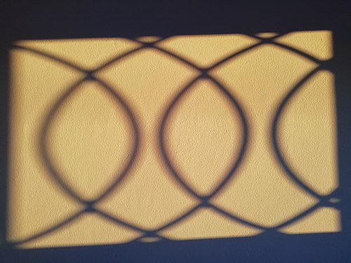 Shadows of window bars on the wall,sabratah,Libya