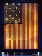 Star Spangled Banner Flag on display at the Smithsonian's National Museum of History and Technology, around 1964.jpg