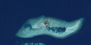 Landsat image of the island with the much larger surrounding coral reef