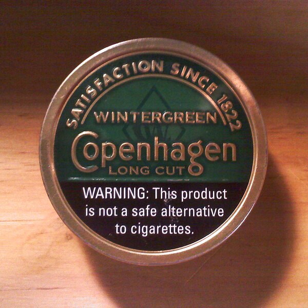 A can of Copenhagen with a warning label