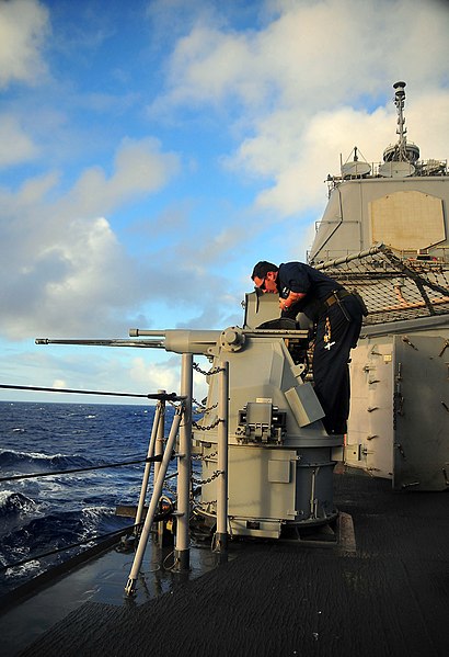 File:US Navy 090129-N-4774B-007 Gunner's Mate 2nd Class Nicholas Brassard performs maintenance on the MK-38 25mm machine gun system.jpg