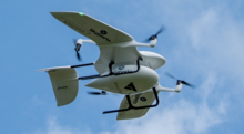 A Wingcopter drone delivering COVID-19 test kits in Scotland. Wingcopter Drone in Scotland.png