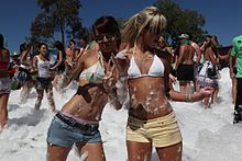 Women wearing a bikini top and normal shorts in 2009 Women at a foam party.jpg