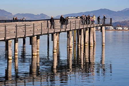 Holzbrücke (wooden bridge) between Rapperswil and Hurden in Switzerland, crossing Obersee (upper Lake Zurich), Seedamm to the left, Jona in the background.