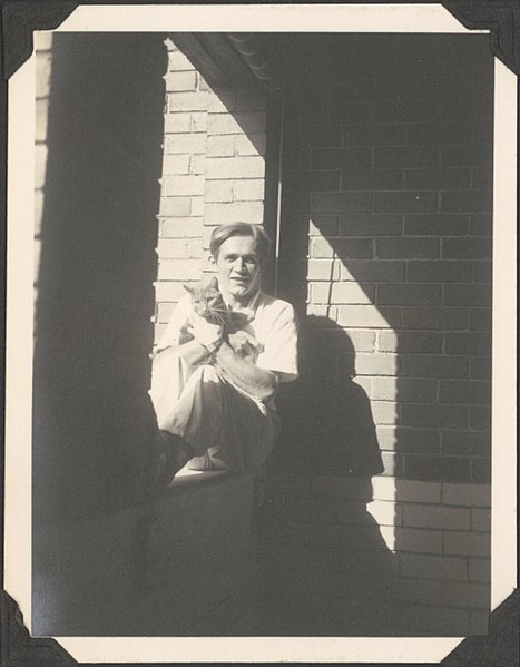 File:(Milos Ristic from the Monte Carlo Russian Ballet, sitting on a ledge holding a cat, between 1936-1937) (33845759772).jpg