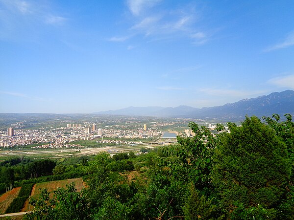 View into the Yellow River Valley west of Mount Song from the edge of the Qinling divide. The settlement is Lantian county.