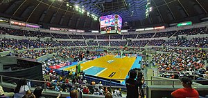 A photo inside the Smart Araneta Coliseum during the 2021 PBA Governors' elimination round game between the Barangay Ginebra San Miguel and the Magnolia Pambansang Manok Hotshots. This is the first time that the two teams played with a live audience since the COVID-19 pandemic began in March 2020. 2021-1225 - Araneta Coliseum Manila Classico (Brgy Ginebra San Miguel vs Magnolia Hotshots).jpg