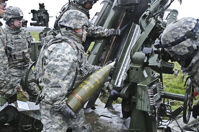 M107 projectile 155 mm projectile being loaded into an M777 howitzer