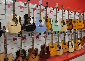 A selection of acoustic guitars in a store, including steel-string and classical type instruments Acoustic guitars in store 20180625.jpg