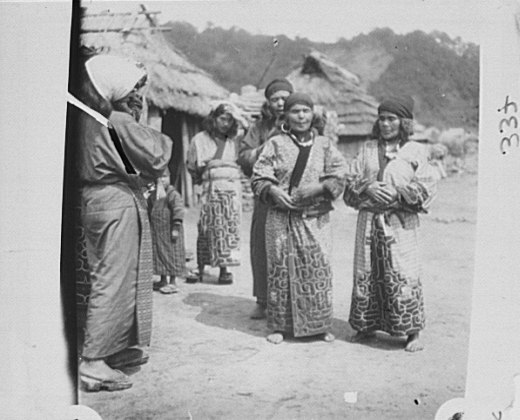 File:Ainu women standing outside in the middle of village LOC agc.7a10192.tif
