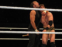 Dean Ambrose setting up his finisher Dirty Deeds (headlock driver) on The Miz. Ambrose Dirty Deeds.jpg