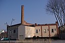 Residential building (former administration building) and brewery storage building with chimney